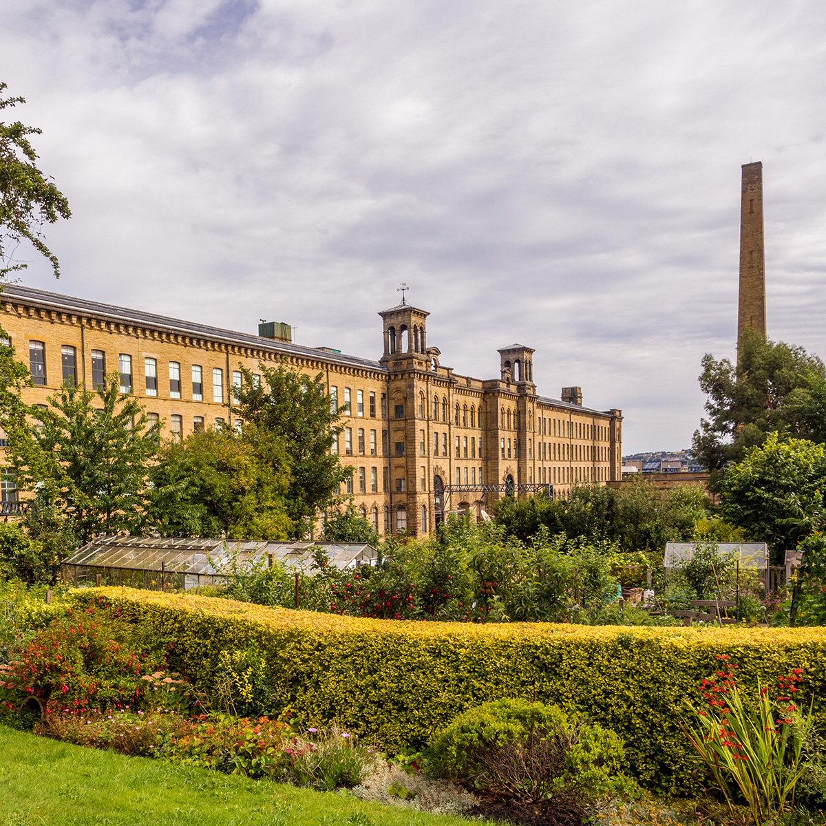 Salts mill and chimney from the village - Ssaltaire West Yorkshire UK